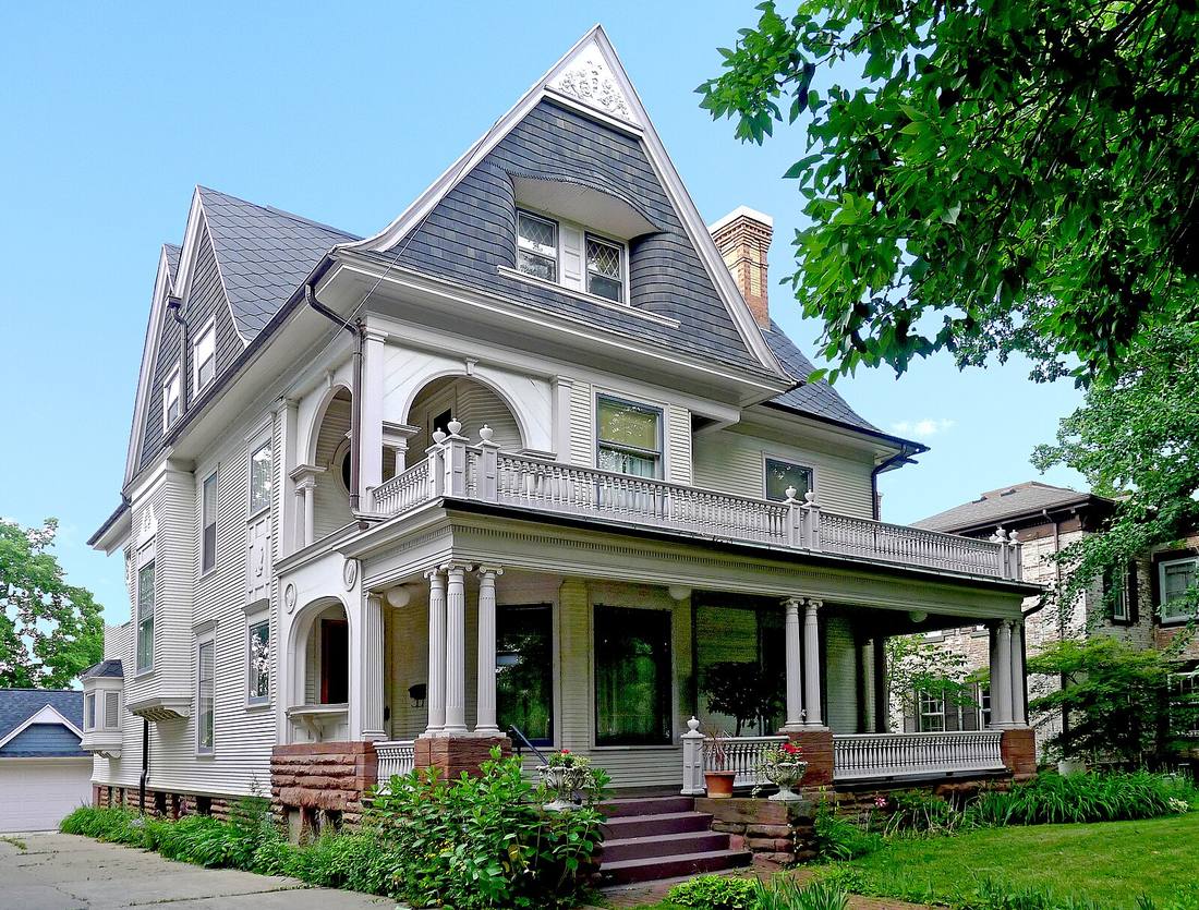 White historic home with a columned porch in a North Jersey neighborhood